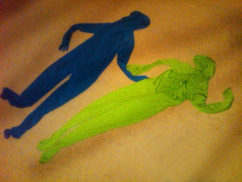 A pair of empty zentai suits on the floor